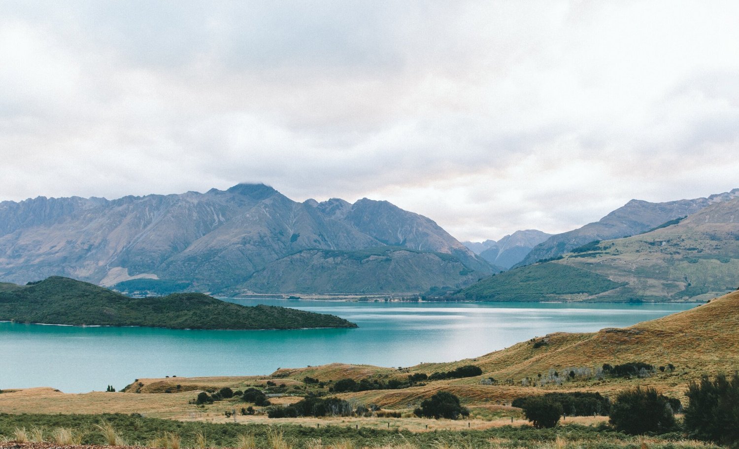 Mountain lake under a cloudy sky